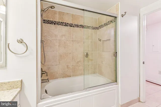 a bathroom with a bath tub and a shower