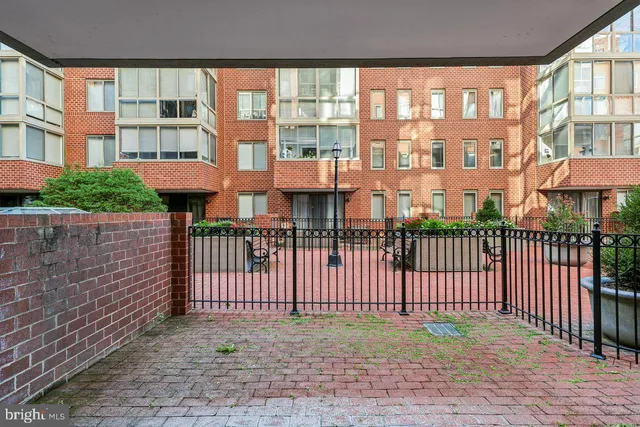 a view of a brick building from a balcony