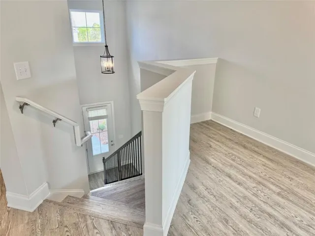 a view of a hallway view with staircase
