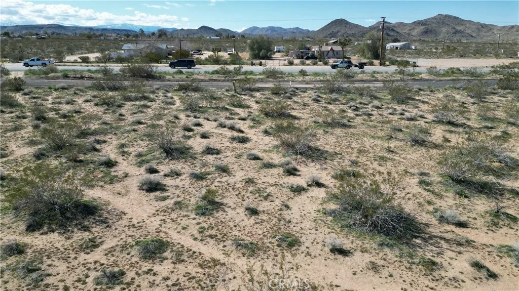 0 Old Woman Springs Road Yucca Valley, CA 92285 - Photo 2 of 11 a view of a town with mountains in the background