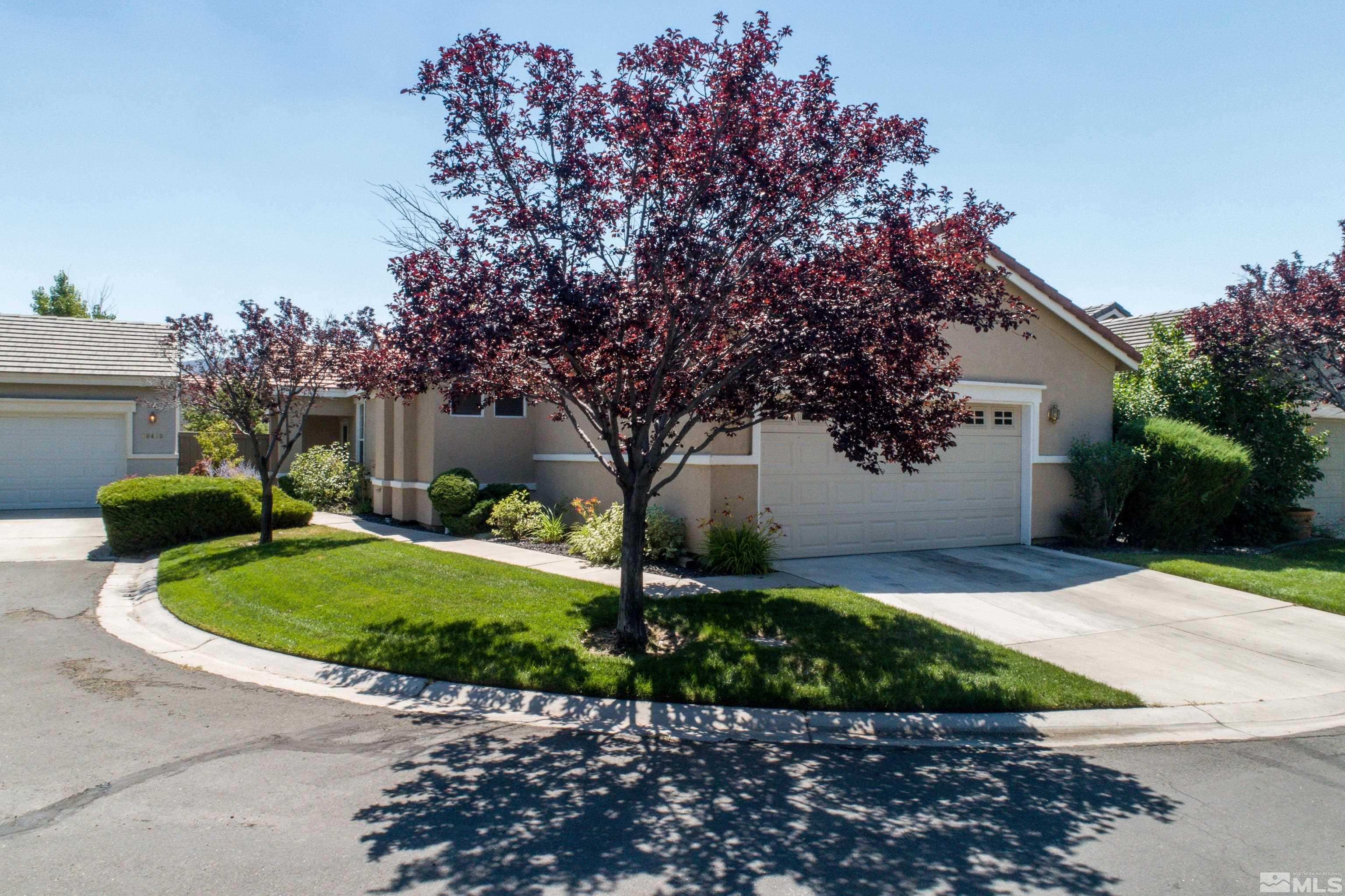 10412 Rockport Lane Reno, NV 89521 - Photo 1 of 15 a front view of a house with a yard and garage