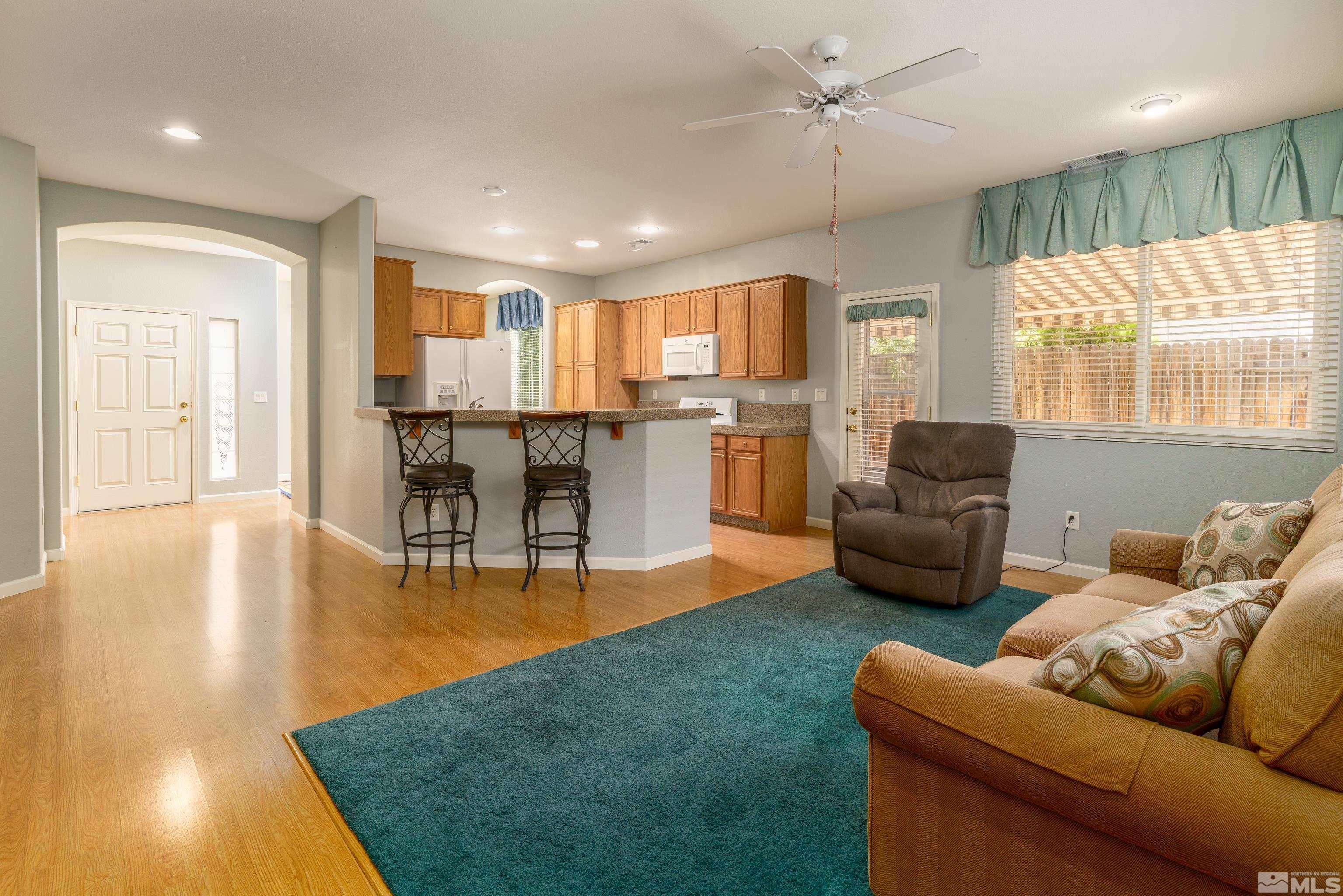 10412 Rockport Lane Reno, NV 89521 - Photo 2 of 15 a living room with furniture and a large window
