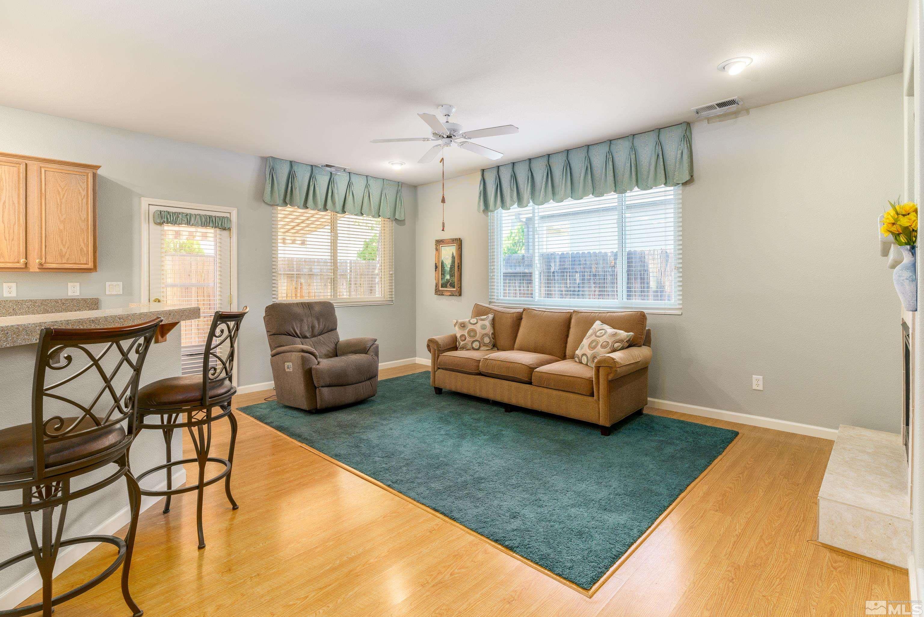 10412 Rockport Lane Reno, NV 89521 - Photo 3 of 15 a living room with furniture and a large window