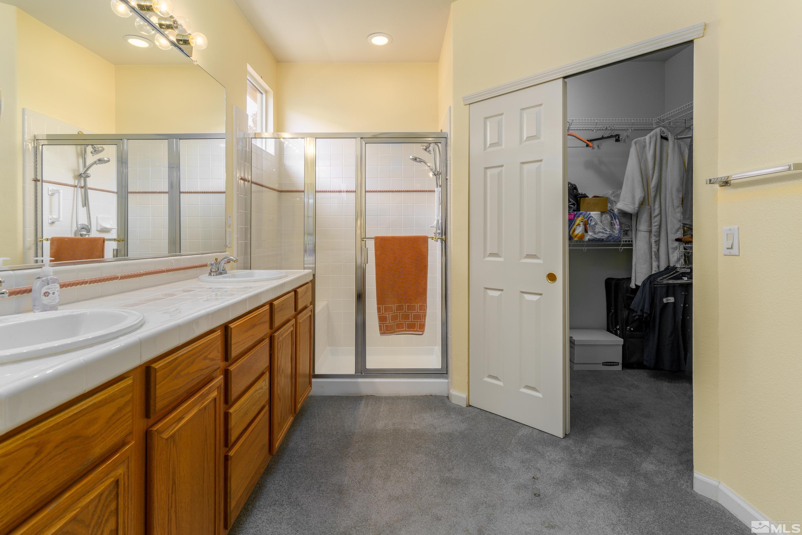 10412 Rockport Lane Reno, NV 89521 - Photo 8 of 15 a bathroom with a sink and a mirror