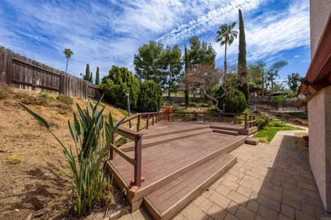 a view of a balcony with chairs
