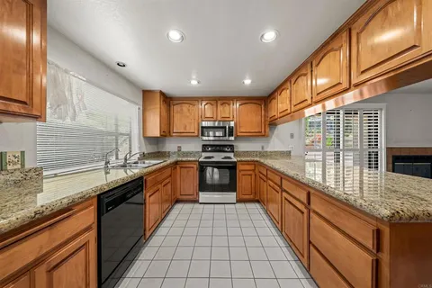 a large kitchen with granite countertop lots of counter top space