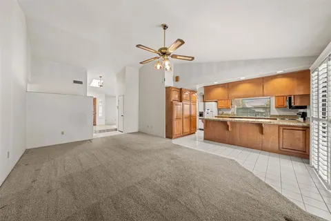 a view of a kitchen with a sink and a kitchen counter top