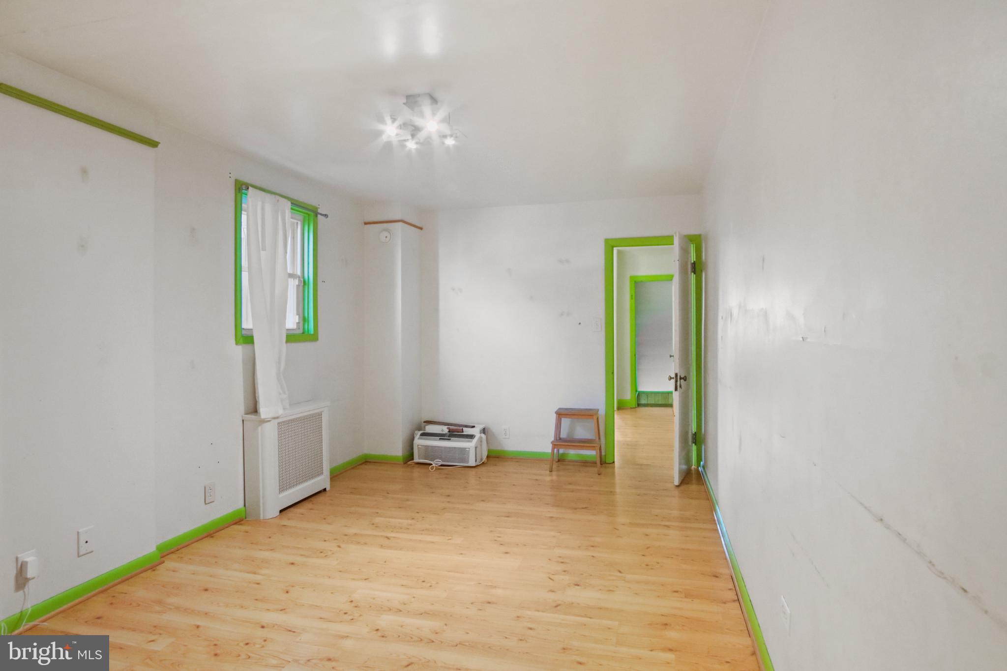 102 Willow Spring Road Baltimore, MD 21222 - Photo 13 of 28 a view of a room with wooden floor