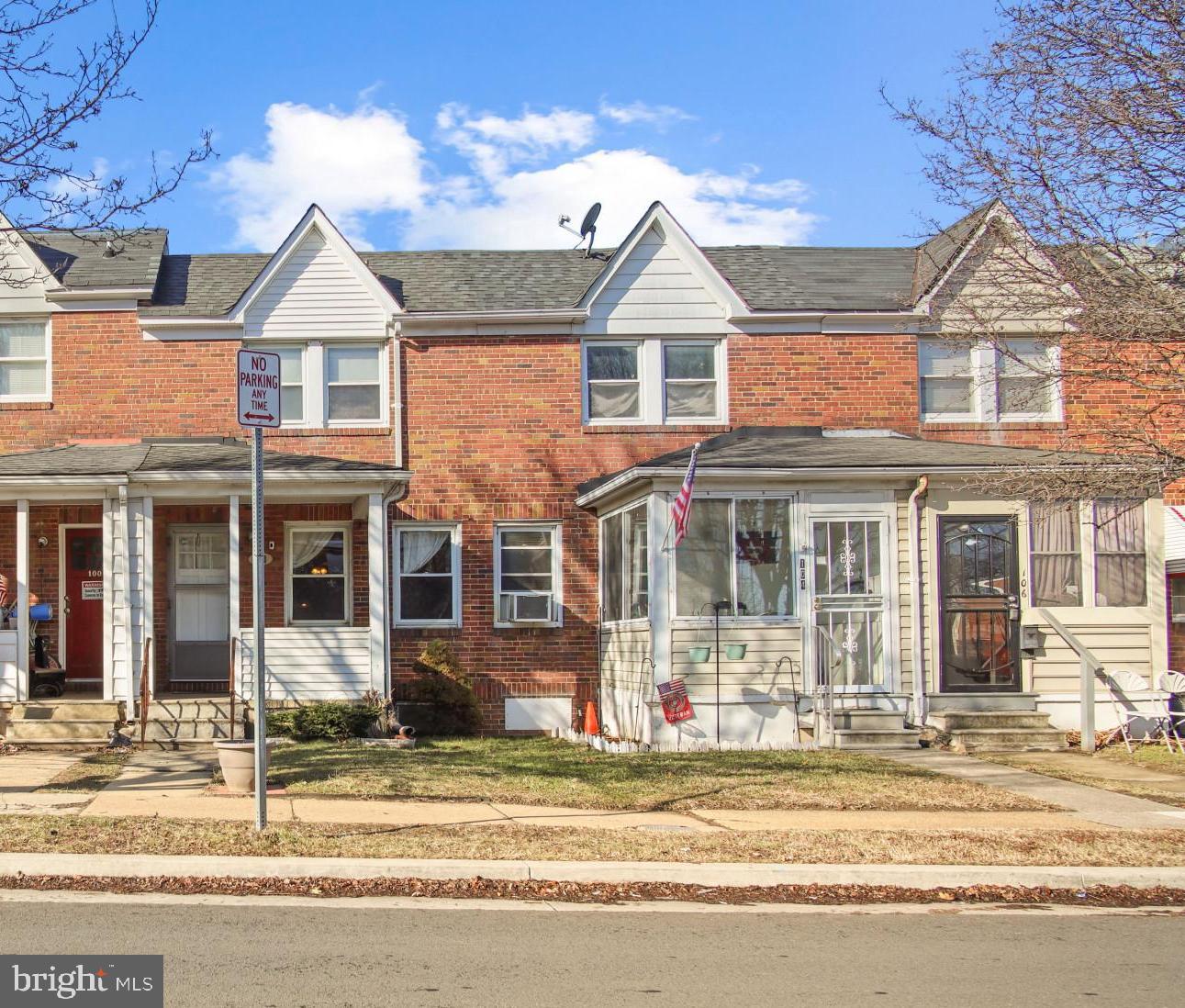 102 Willow Spring Road Baltimore, MD 21222 - Photo 2 of 28 a front view of a house with a yard