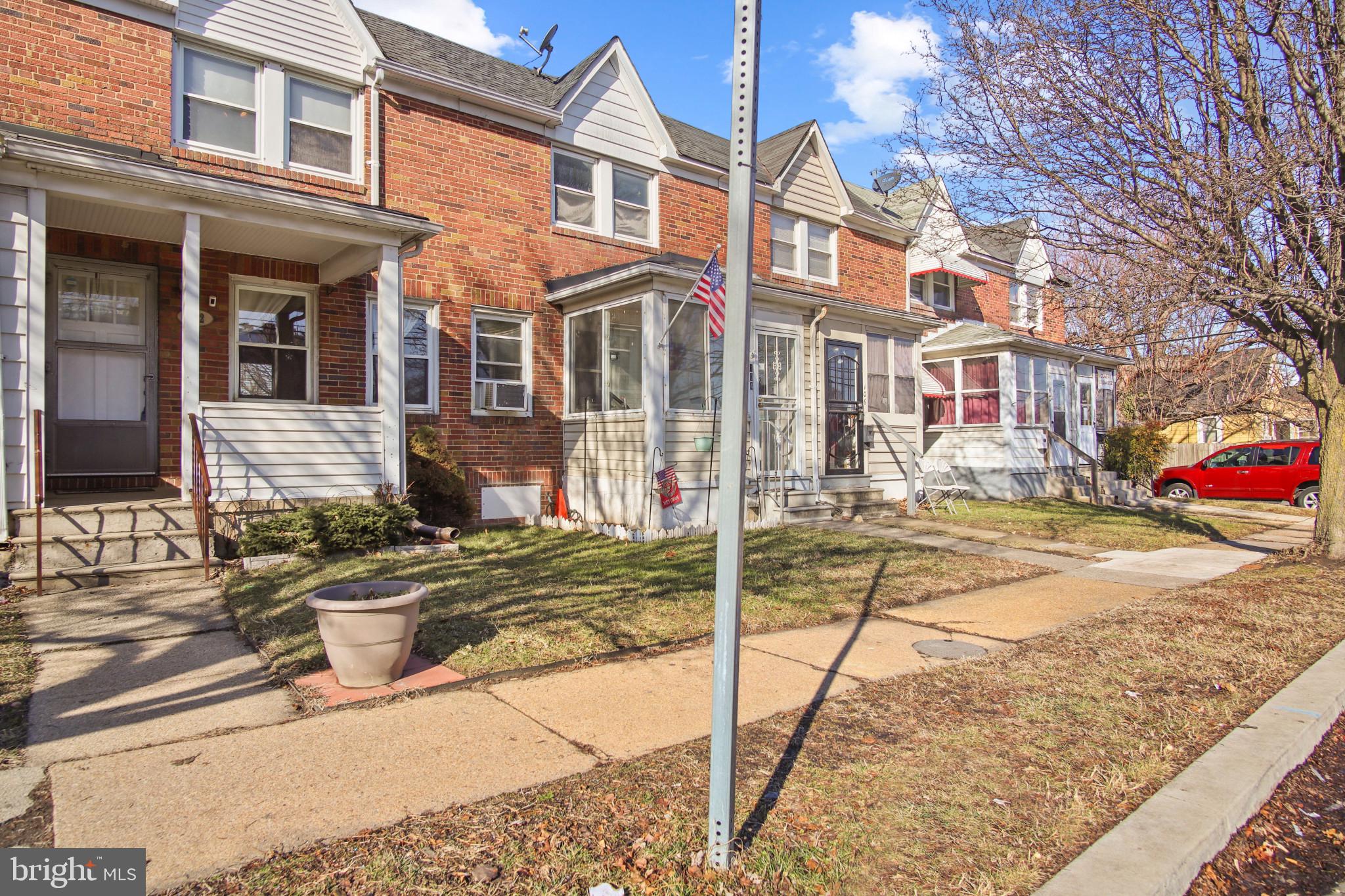 102 Willow Spring Road Baltimore, MD 21222 - Photo 3 of 28 a view of a brick house with many windows