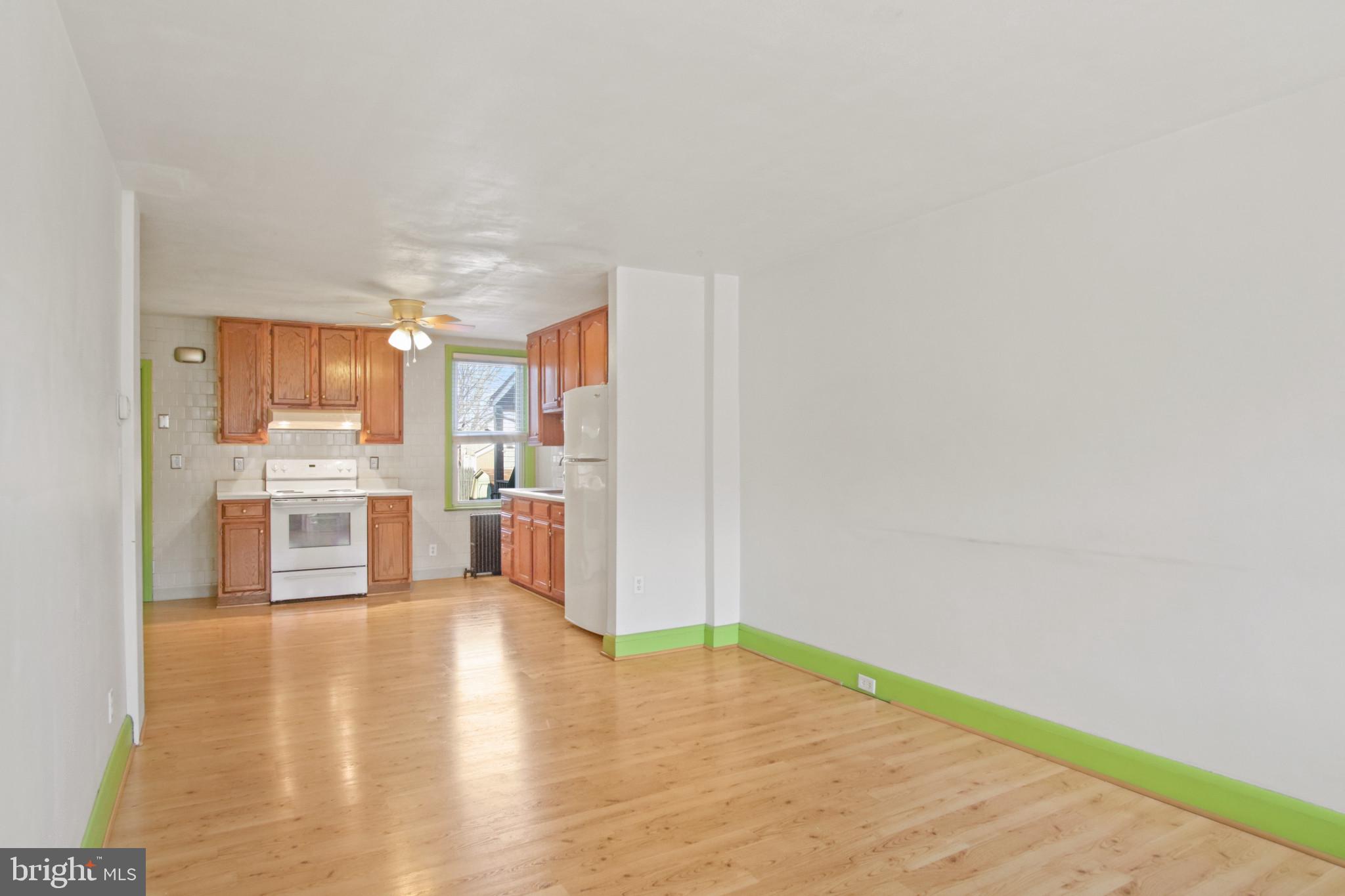 102 Willow Spring Road Baltimore, MD 21222 - Photo 4 of 28 a view of a kitchen with wooden floor