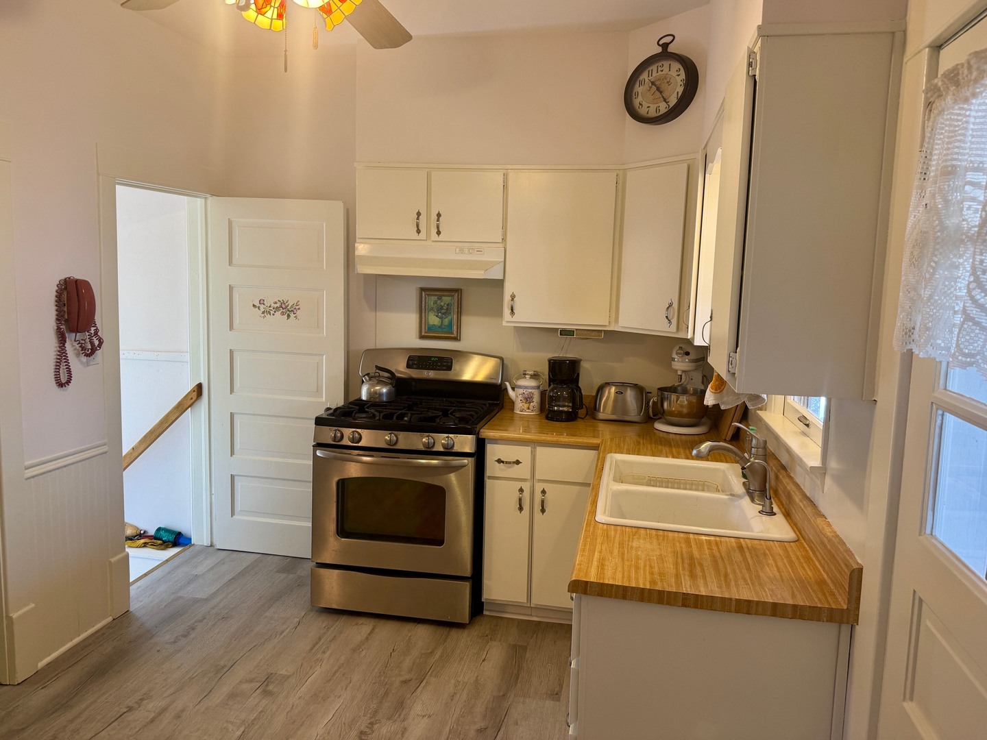 742 South 4th Street DeKalb, IL 60115 - Photo 3 of 46 a kitchen with stainless steel appliances a stove a sink and a refrigerator