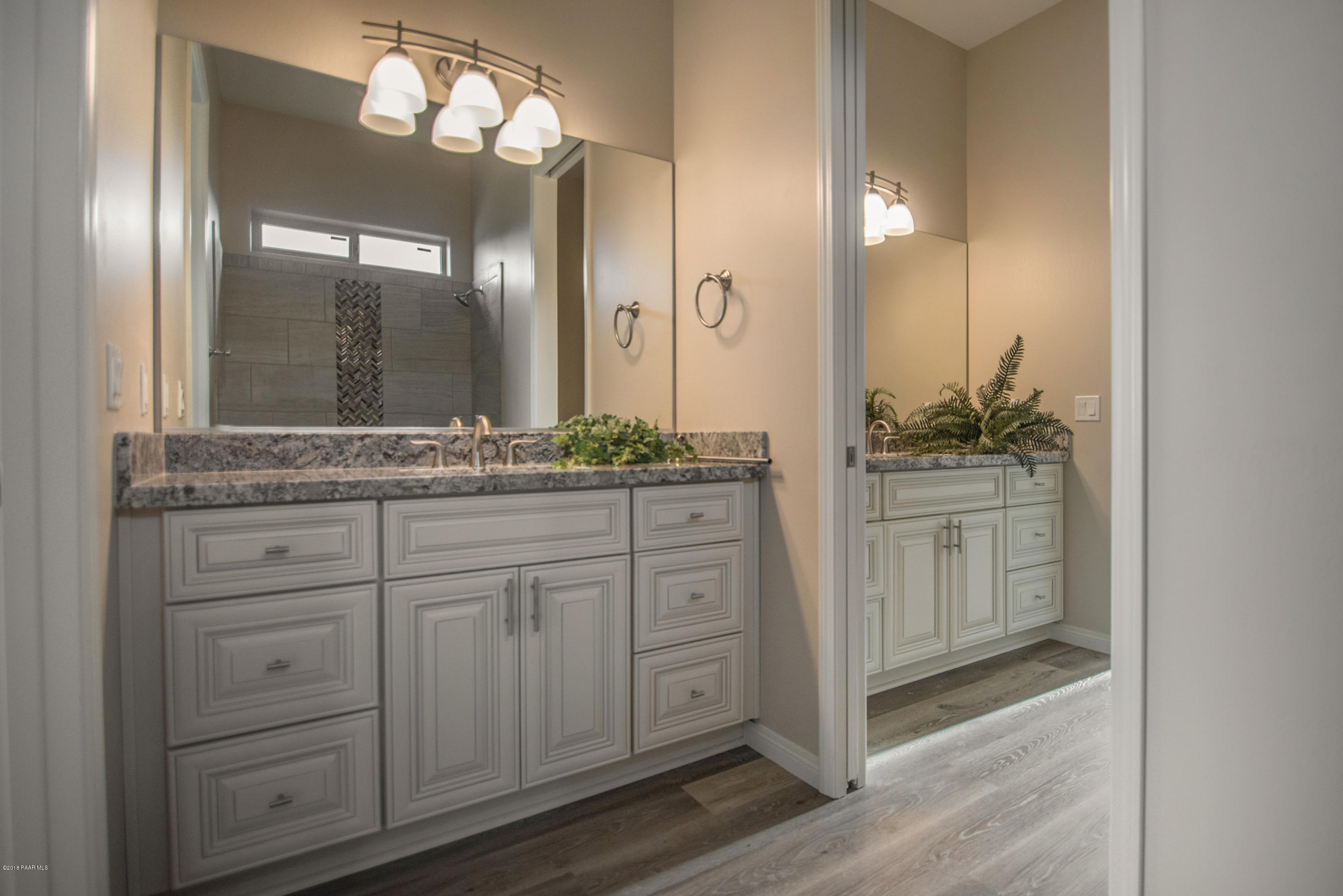 531 Miracle Rider Road Prescott, AZ 86301 - Photo 11 of 31 a bathroom with a sink and a mirror