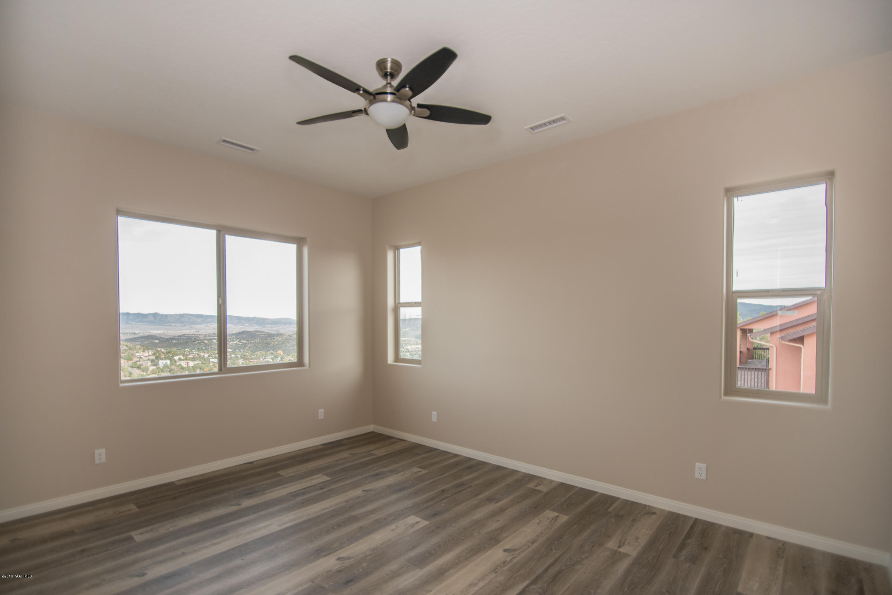 531 Miracle Rider Road Prescott, AZ 86301 - Photo 18 of 31 a view of a big room with wooden floor and windows
