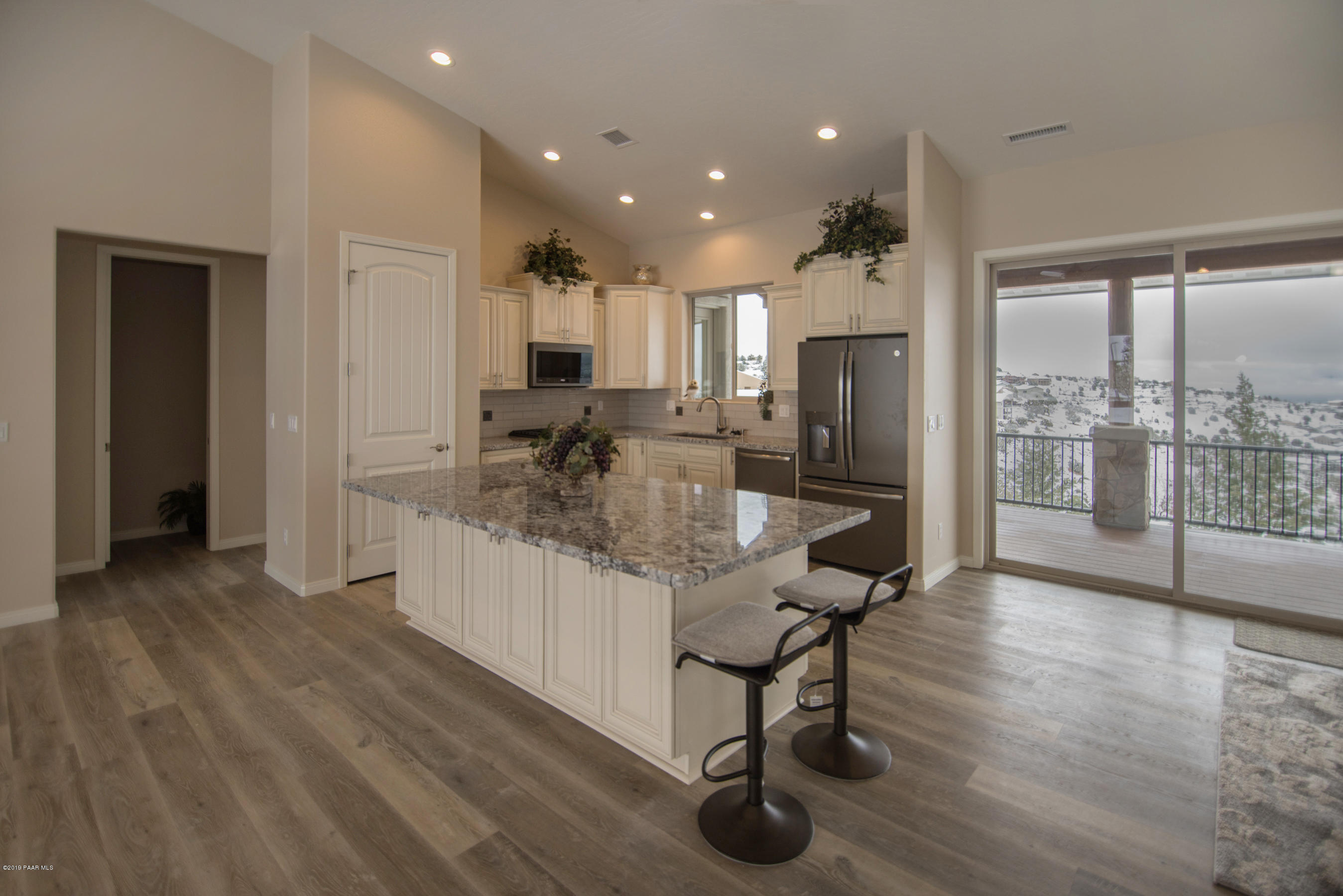 531 Miracle Rider Road Prescott, AZ 86301 - Photo 2 of 31 a kitchen with granite countertop cabinets and wooden floor