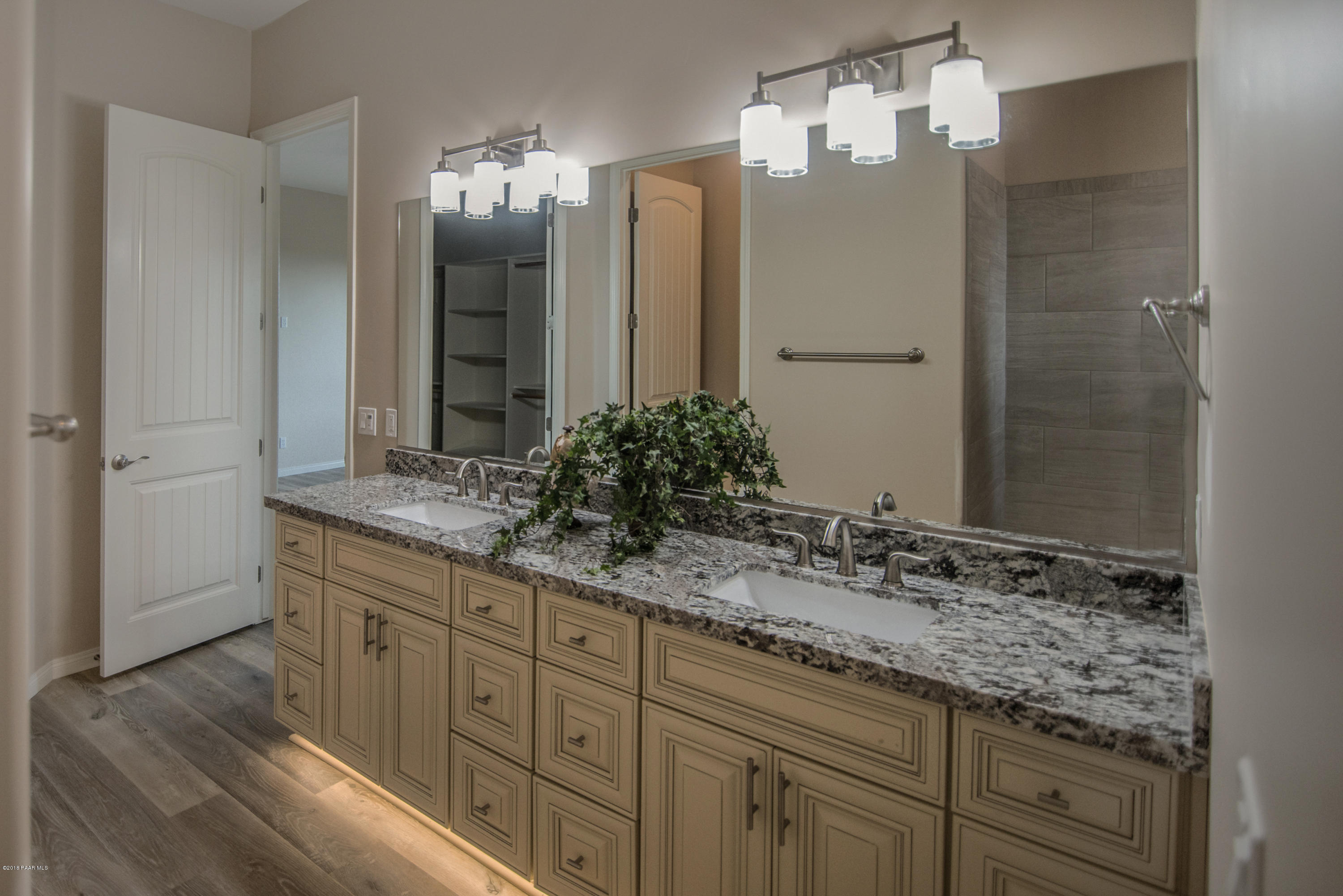 531 Miracle Rider Road Prescott, AZ 86301 - Photo 22 of 31 a bathroom with a granite countertop double vanity sink and a mirror