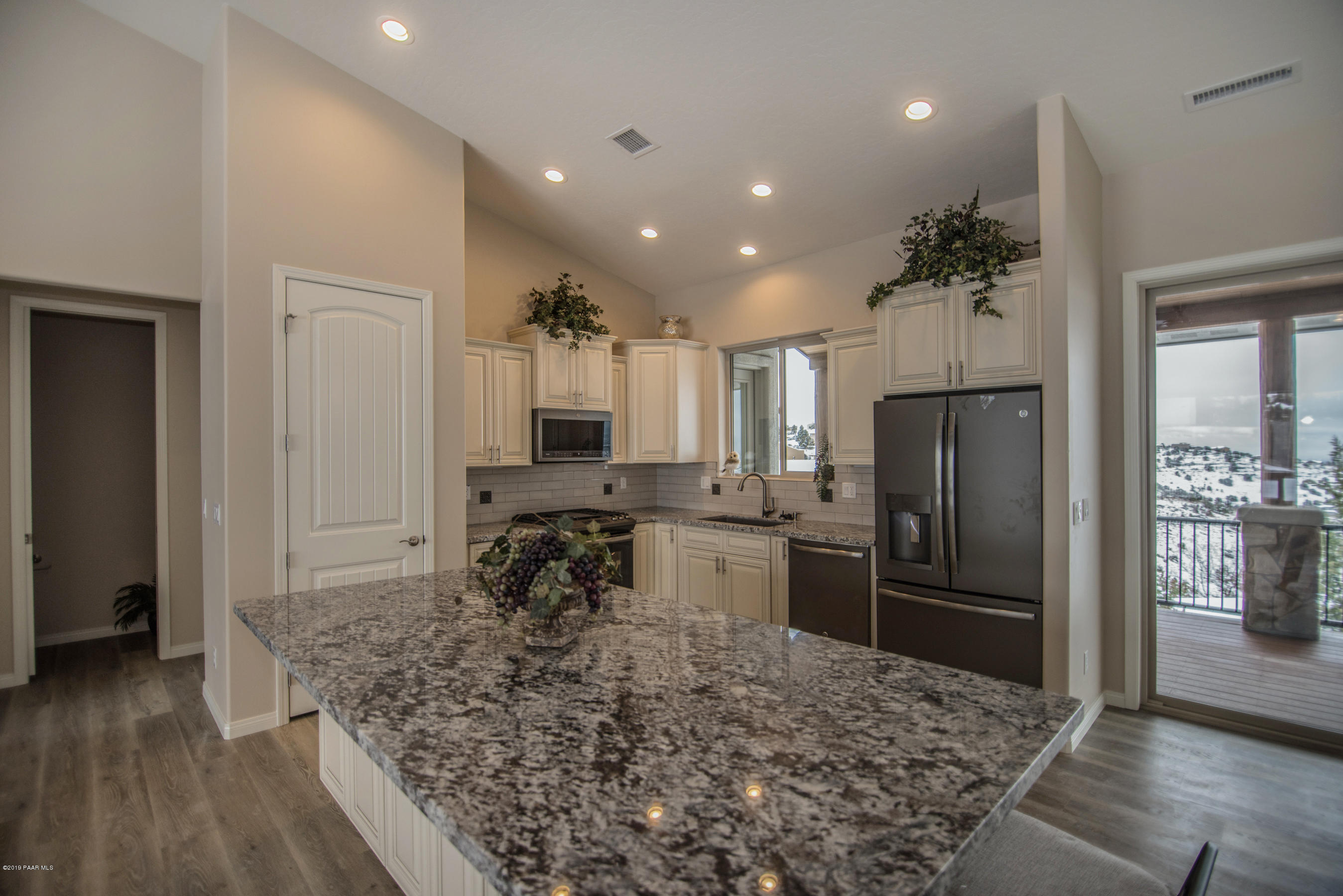 531 Miracle Rider Road Prescott, AZ 86301 - Photo 31 of 31 a kitchen with a refrigerator and a stove top oven