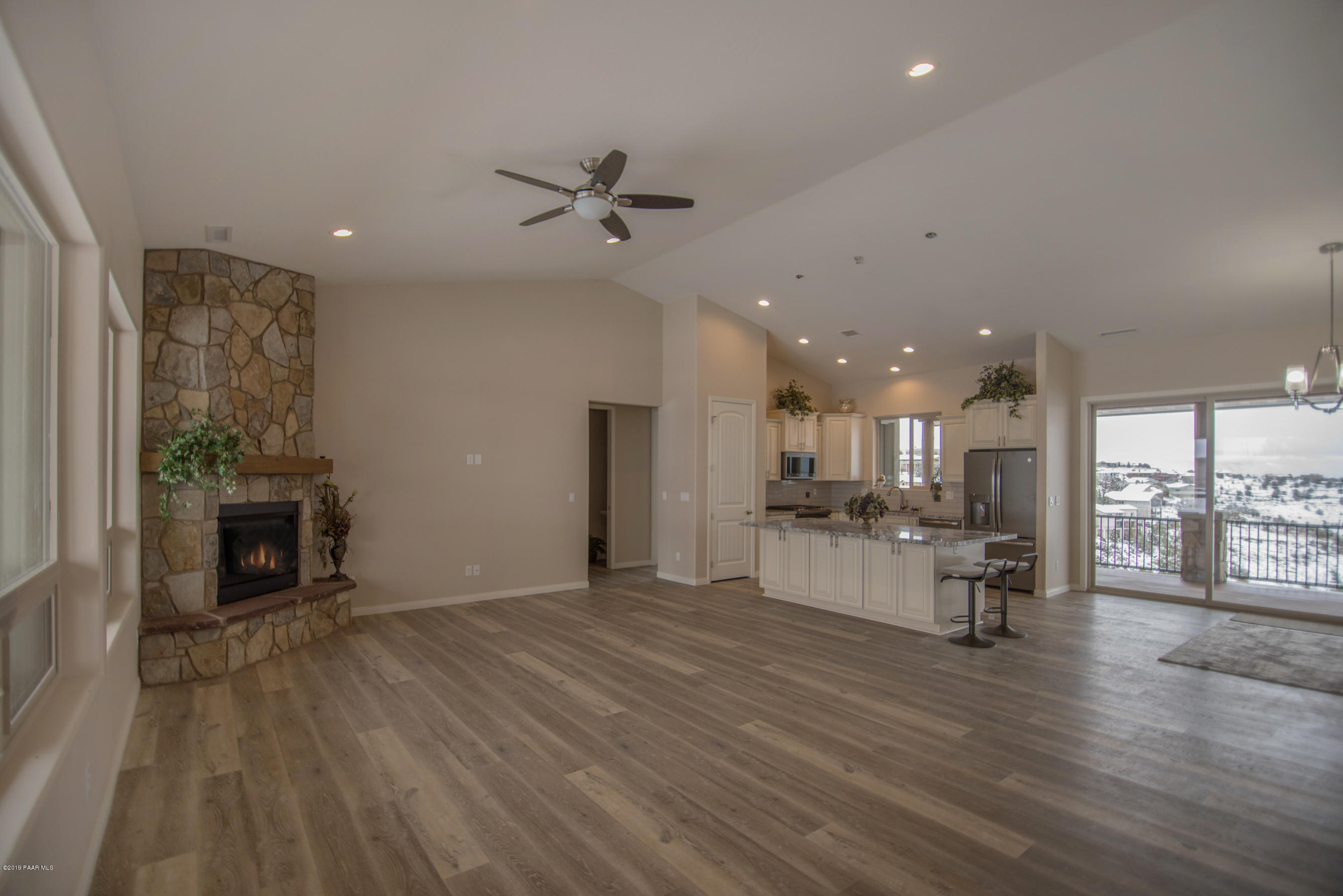 531 Miracle Rider Road Prescott, AZ 86301 - Photo 7 of 31 a living room with furniture and a fireplace