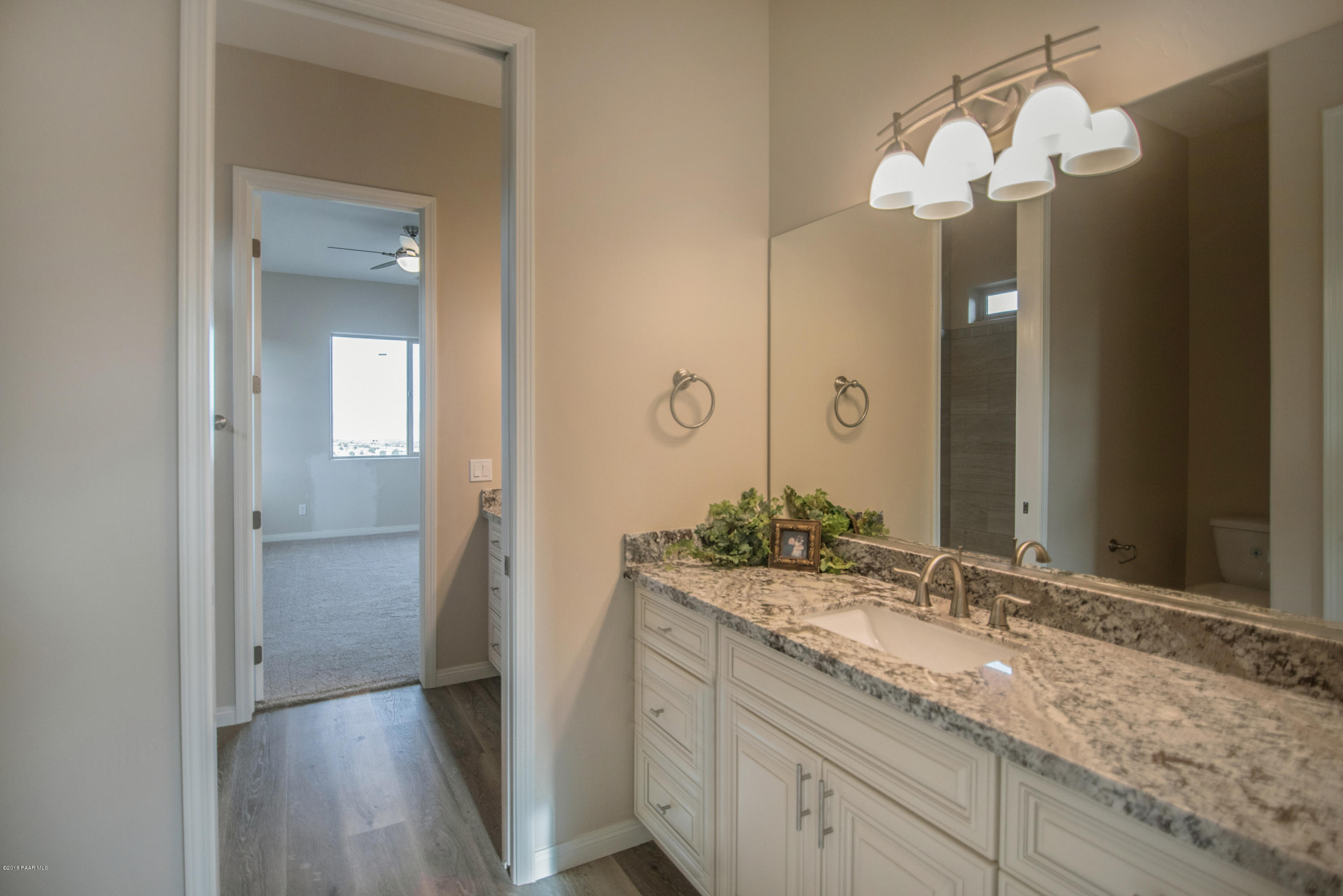 531 Miracle Rider Road Prescott, AZ 86301 - Photo 10 of 31 a bathroom with a double vanity sink and a mirror
