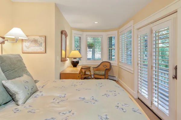 a kitchen with white cabinets appliances and a sink