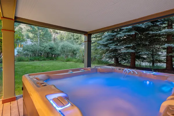 an aerial view of residential house with an outdoor space and seating