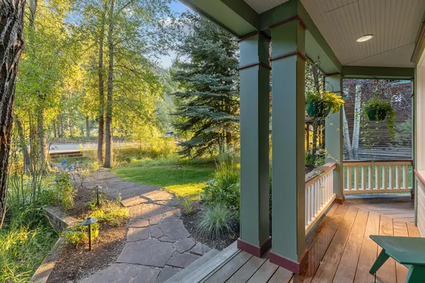 a outdoor living space with patio furniture and a fireplace