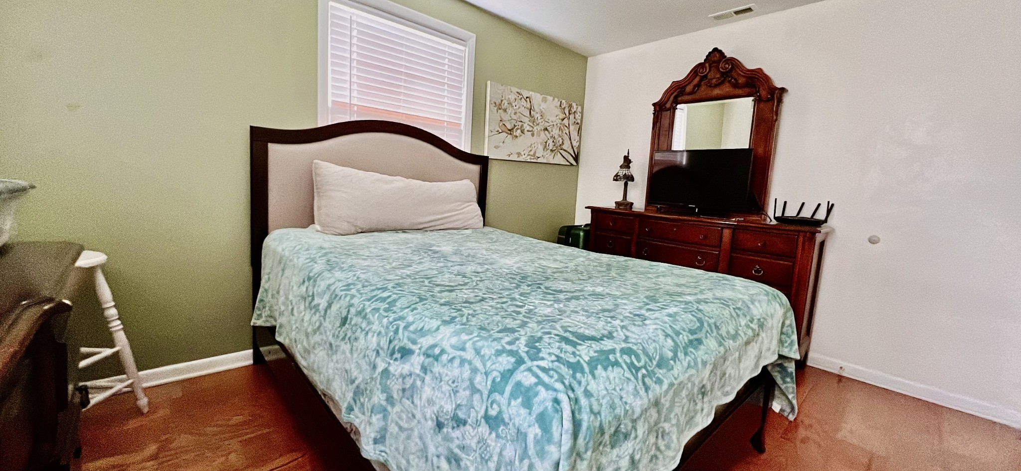 319 Copeland Road Clarksville, TN 37042 - Photo 17 of 30 a bedroom with a bed and a flat tv screen on a dresser