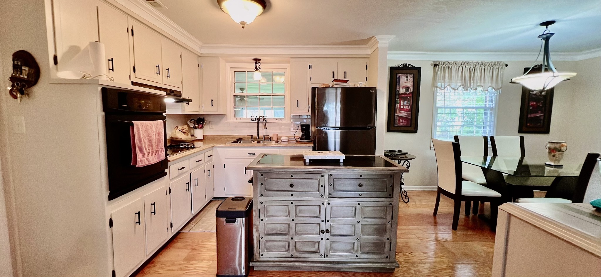 319 Copeland Road Clarksville, TN 37042 - Photo 6 of 30 a kitchen with stainless steel appliances kitchen island granite countertop a refrigerator a stove top oven a sink and dishwasher