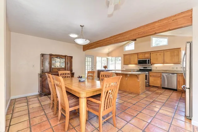 a kitchen with stainless steel appliances a sink dishwasher stove and microwave