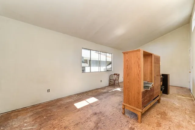 a view of a backyard with large trees