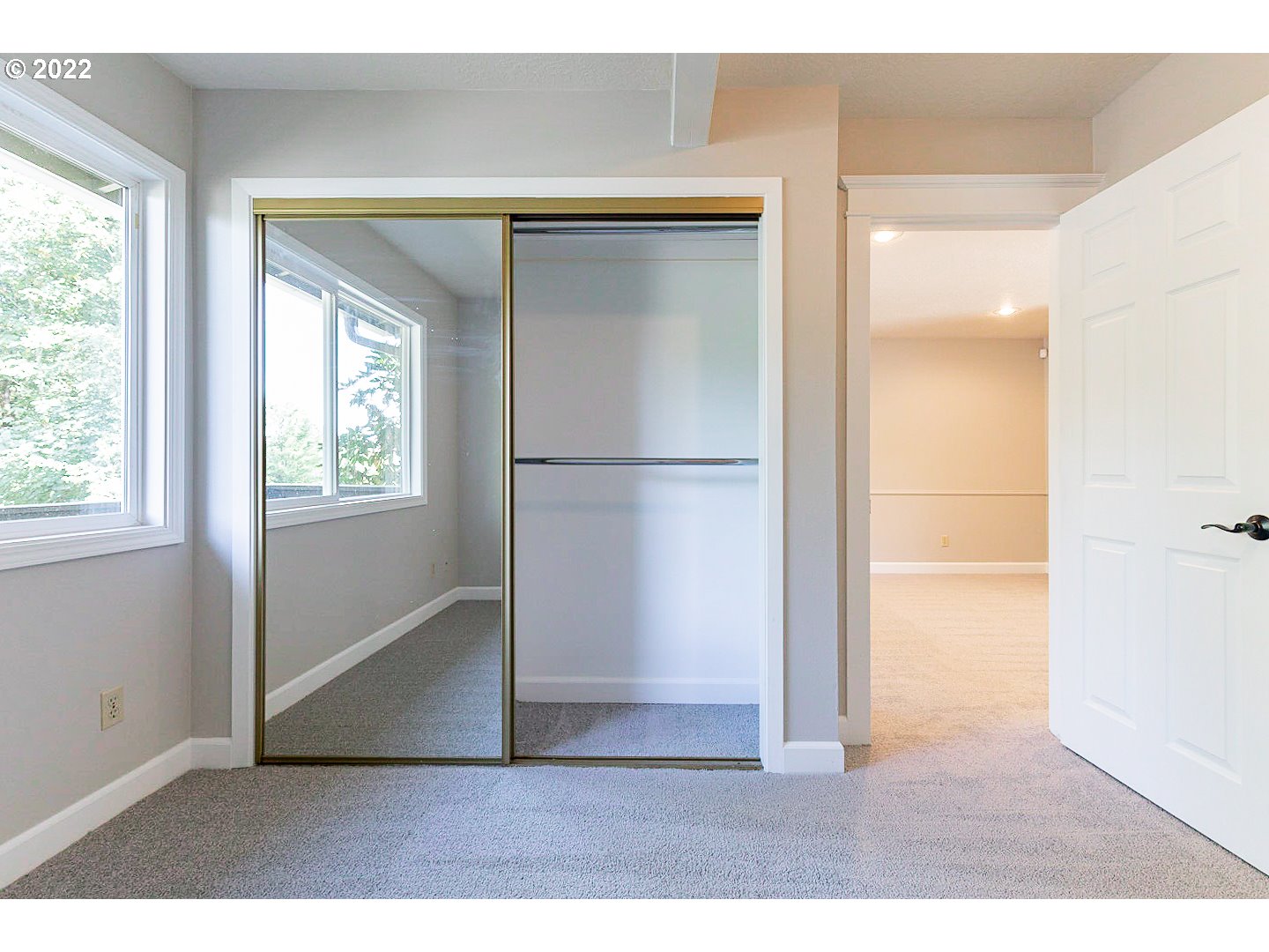 1302 Southwest 19th Drive Gresham, OR 97080 - Photo 18 of 32 a view of empty room with wooden floor and windows
