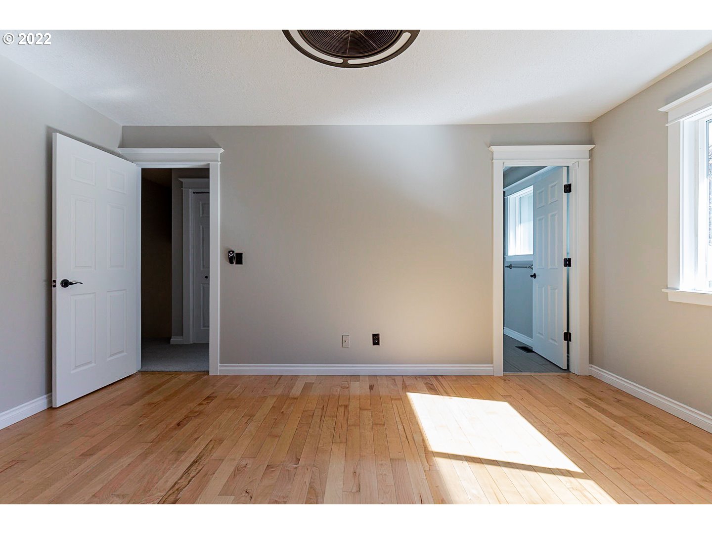 1302 Southwest 19th Drive Gresham, OR 97080 - Photo 22 of 32 a view of an empty room with wooden floor