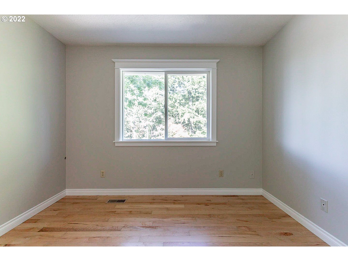 1302 Southwest 19th Drive Gresham, OR 97080 - Photo 24 of 32 an empty room with wooden floor and window