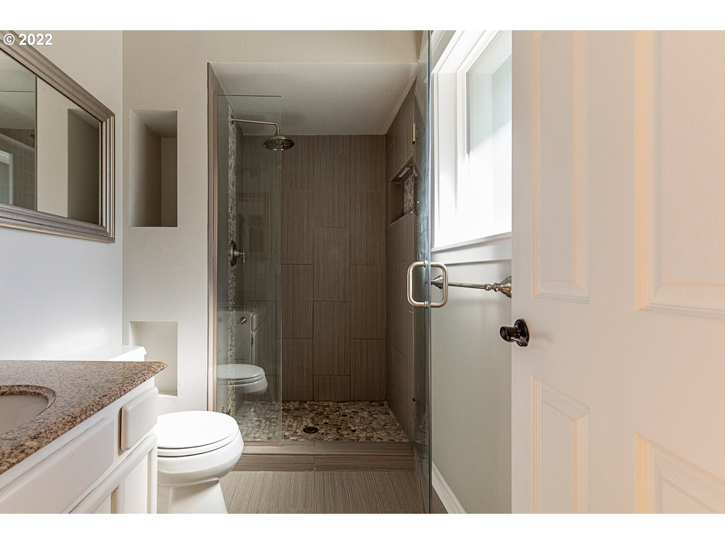 1302 Southwest 19th Drive Gresham, OR 97080 - Photo 27 of 32 a bathroom with a sink a toilet and shower