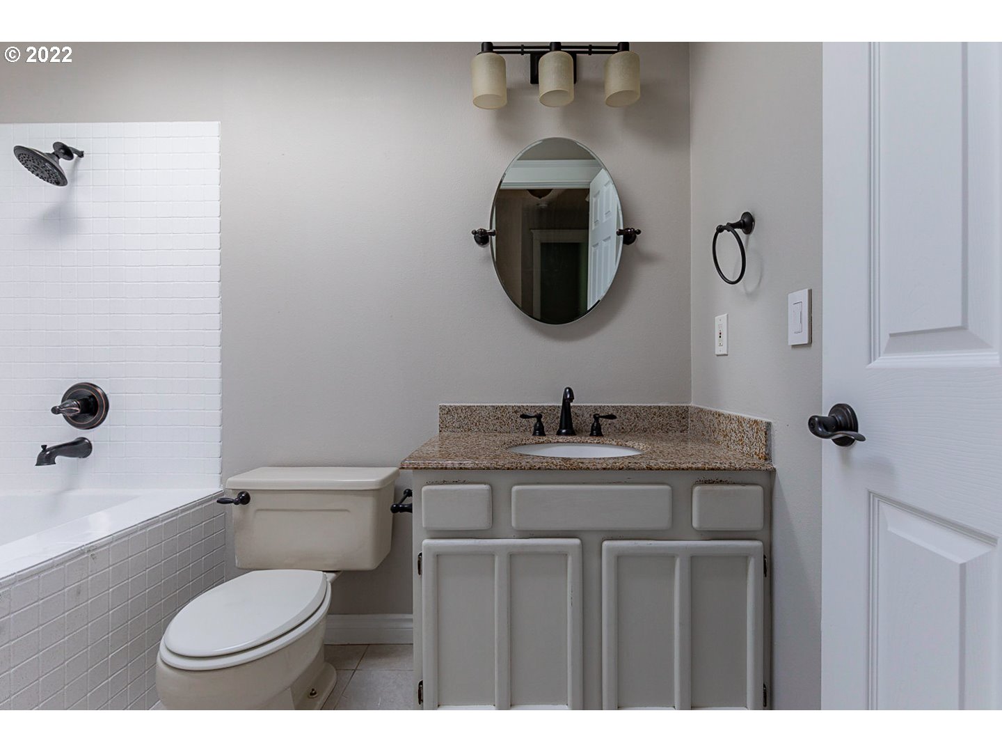 1302 Southwest 19th Drive Gresham, OR 97080 - Photo 29 of 32 a bathroom with a toilet sink and mirror