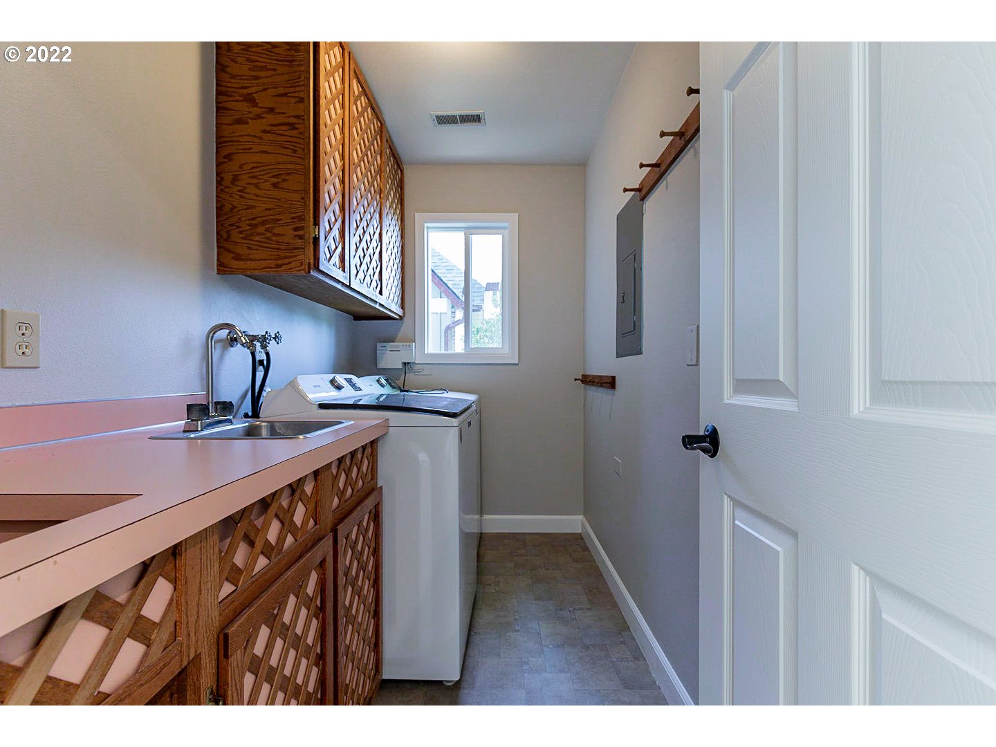 1302 Southwest 19th Drive Gresham, OR 97080 - Photo 30 of 32 a kitchen with a sink and cabinets