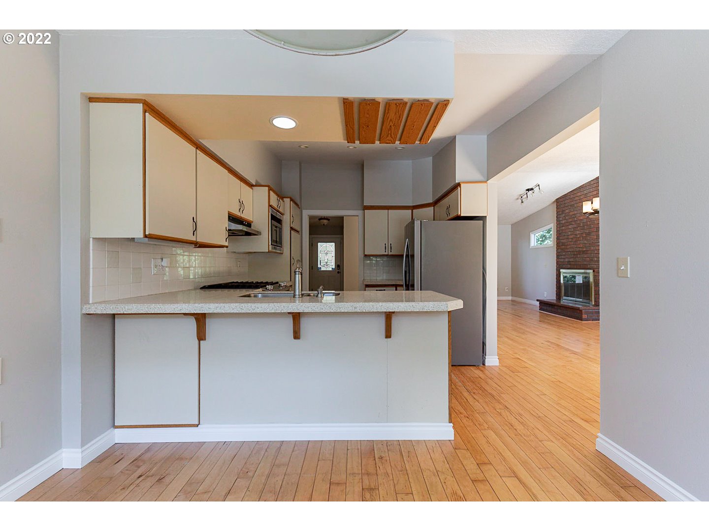 1302 Southwest 19th Drive Gresham, OR 97080 - Photo 7 of 32 a view of kitchen with stainless steel appliances granite countertop a sink and a stove