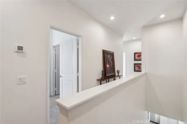 a bathroom with a double vanity sink mirror and toilet