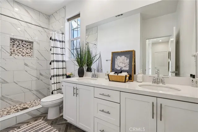 a bedroom with a bed and cabinets