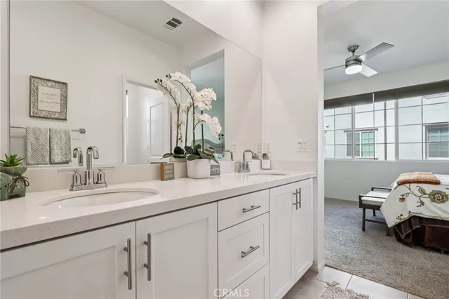 a bedroom with a bed and a desk