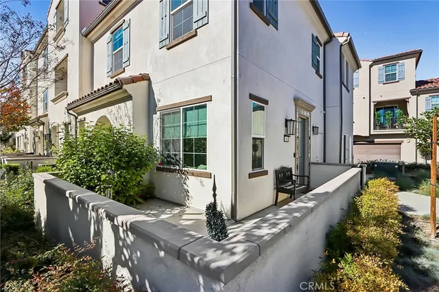 a view of an buildings from the balcony