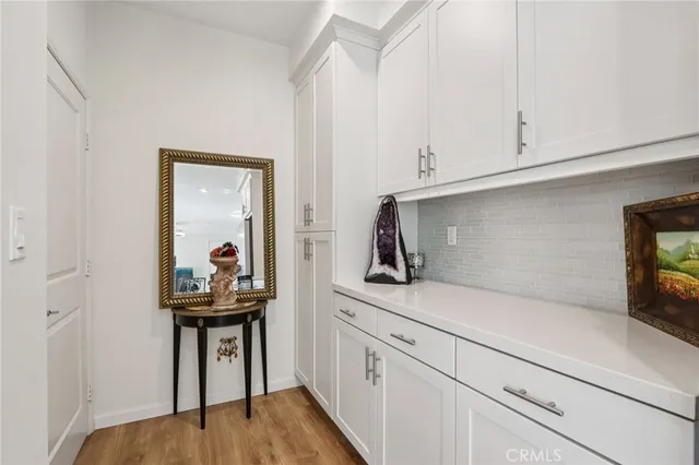 a bathroom with a sink mirror vanity and toilet