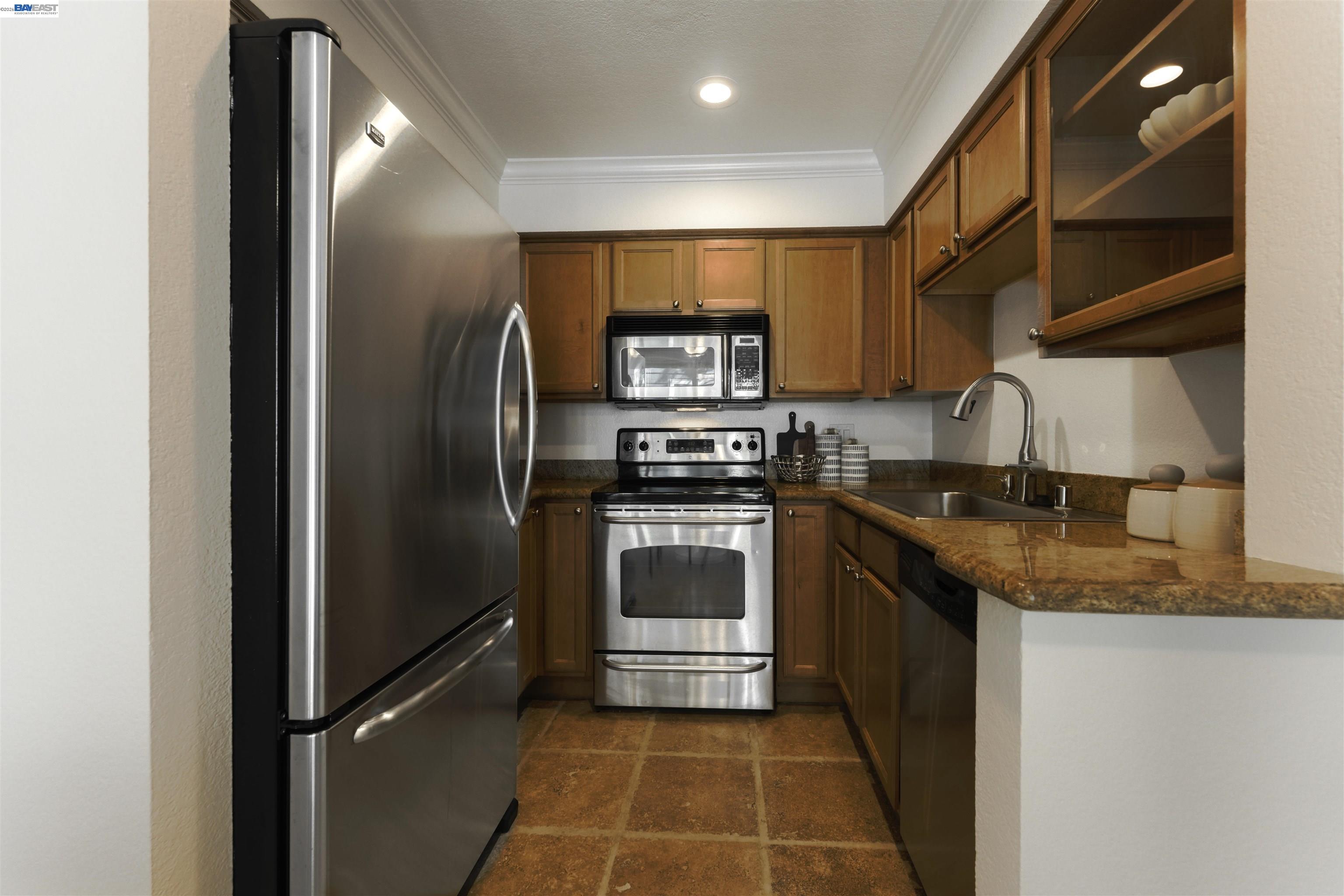 364 Eastridge Drive San Ramon, CA 94582 - Photo 11 of 23 a kitchen with stainless steel appliances granite countertop a refrigerator and a stove