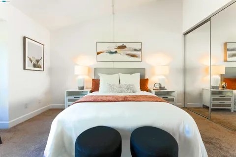 a bedroom with a bed and a table