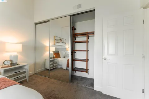 a bedroom with furniture and a window