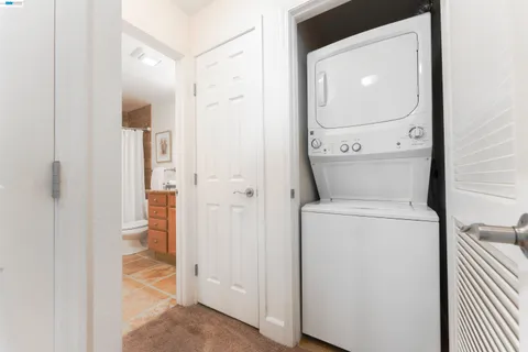 a view of bathroom with a washer and dryer