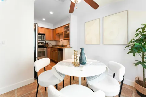 a kitchen with a table and chairs in it