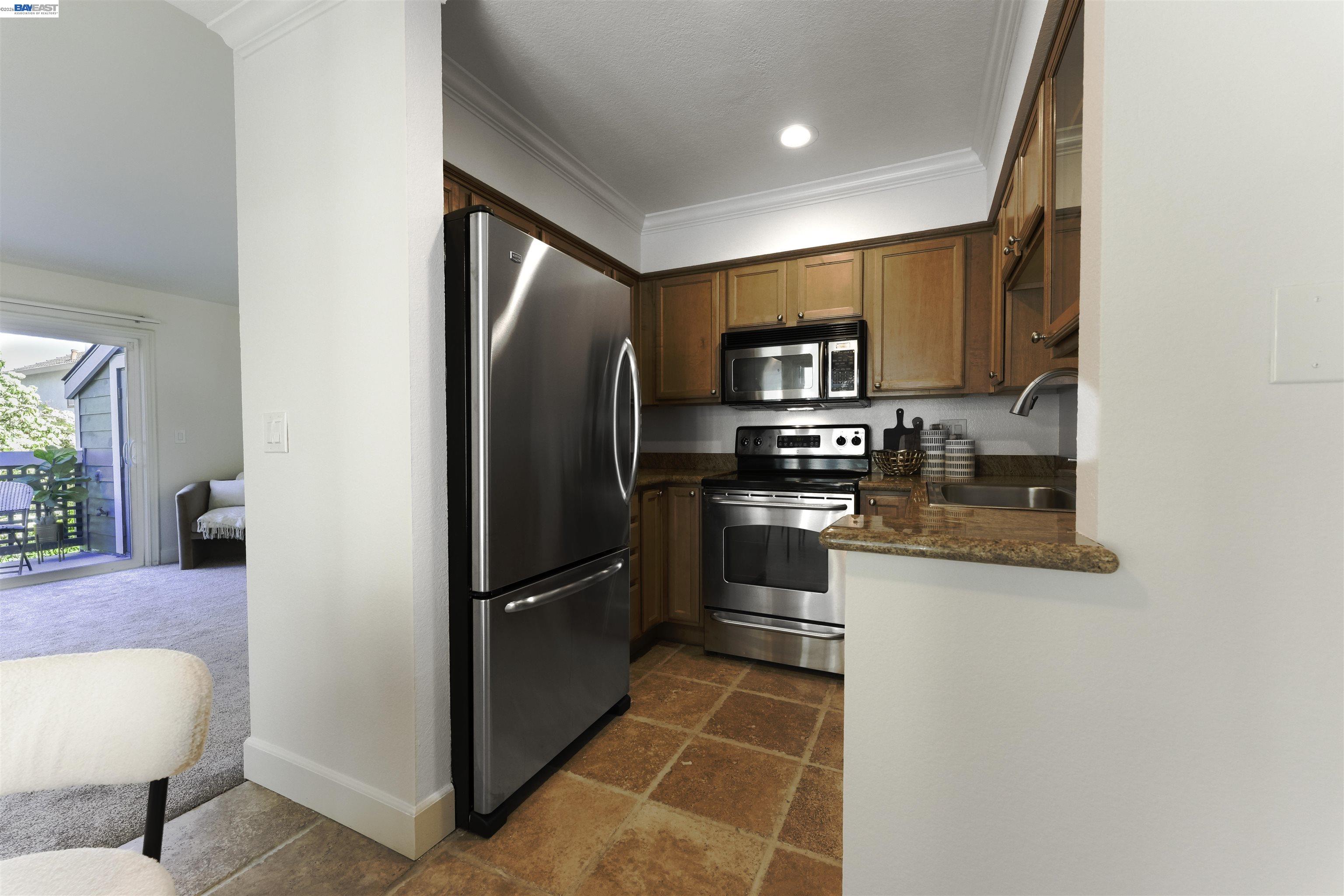 364 Eastridge Drive San Ramon, CA 94582 - Photo 10 of 23 a kitchen with stainless steel appliances granite countertop a refrigerator and a stove
