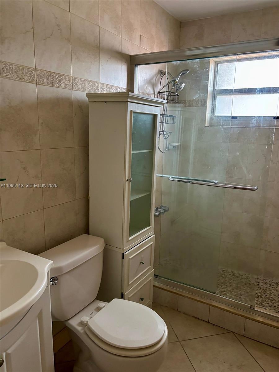 3241 Arthur Terrace Hollywood, FL 33021 - Photo 11 of 22 a white toilet sitting next to a shower