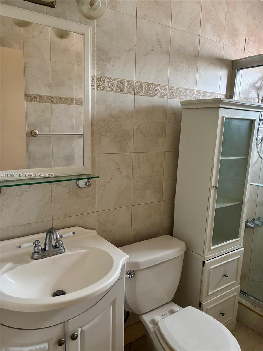 3241 Arthur Terrace Hollywood, FL 33021 - Photo 12 of 22 a bathroom with a sink and toilet